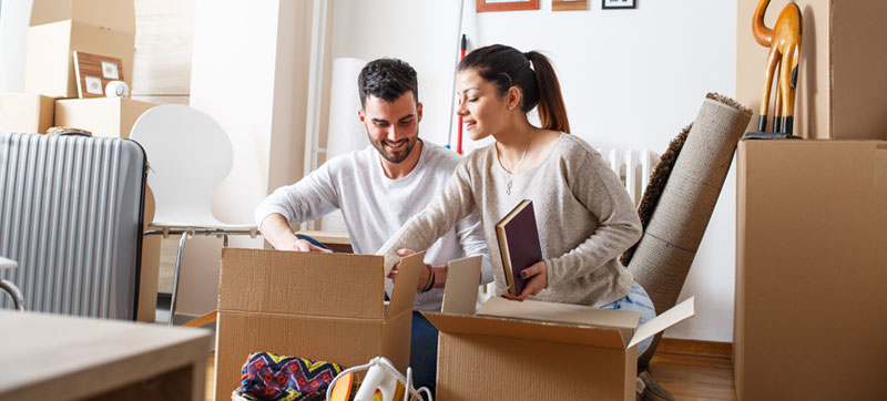 Happy couple unpacking